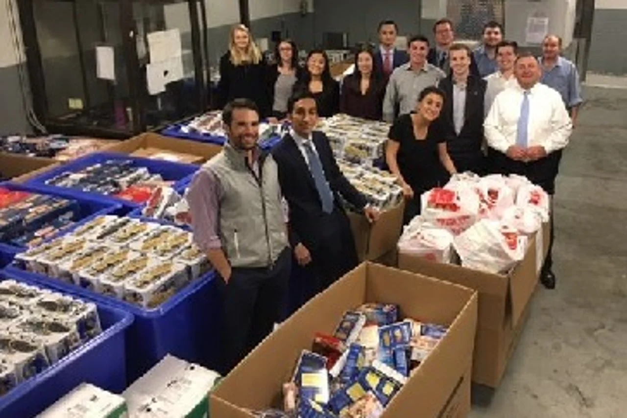 Employees prepare their food drive collection for pickup