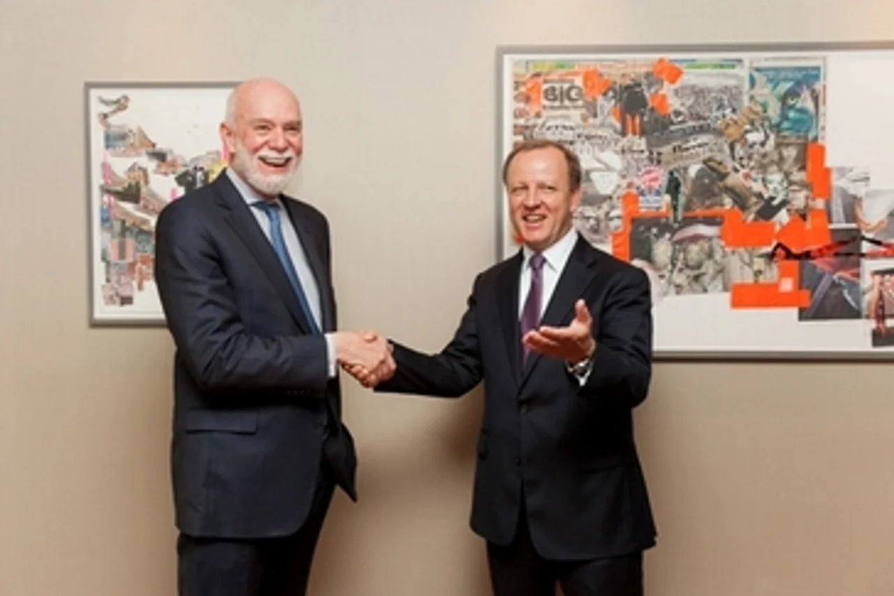 Stefan Krause (R), Deutsche Bank Management Board member, greets Richard Armstrong (L), Director of the Solomon R. Guggenheim Museum and Foundation.
